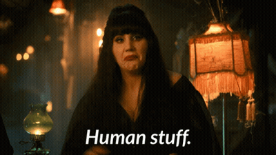A Woman With A Lamp Behind Her Says " Human Stuff " GIF