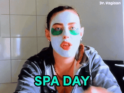 A Woman With A Mask On Her Face And The Words Spa Day GIF