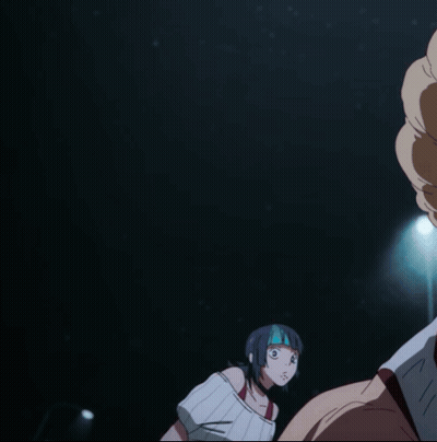 A Woman With A Mask On Her Face Looks At A Man In A Dark Room GIF