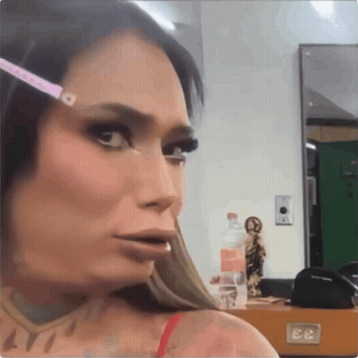 A Woman With A Measuring Tape On Her Eyebrows Looks At The Camera GIF