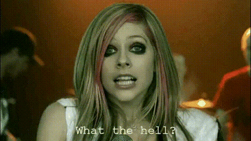 A Woman With A Microphone And The Words What The Hell GIF