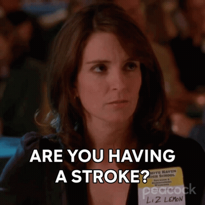 A Woman With A Name Tag That Says Liz Lemon On It GIF