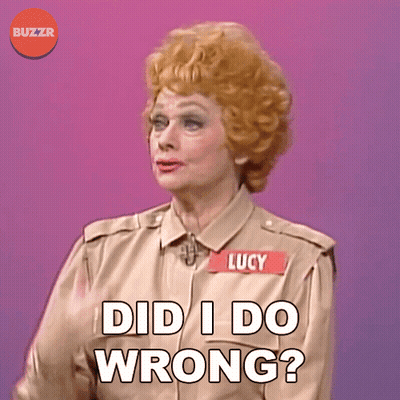 A Woman With A Name Tag That Says Lucy On It GIF