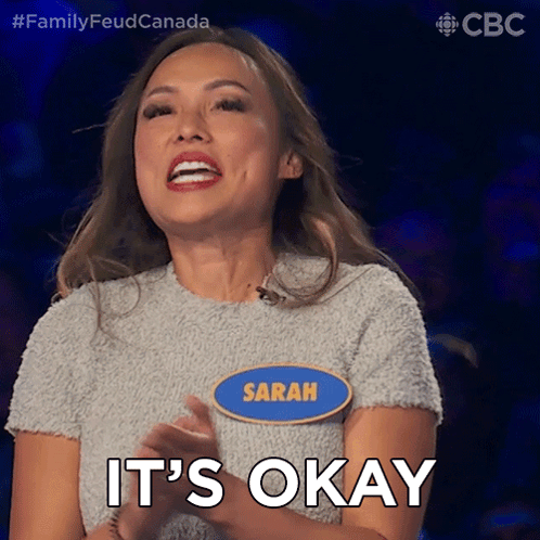 A Woman With A Name Tag That Says " Sarah " On It GIF