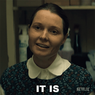 A Woman With A Netflix Logo On Her Sleeve GIF