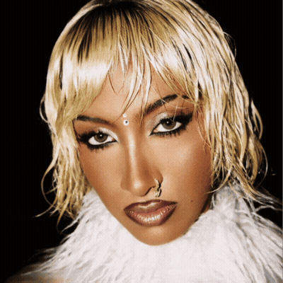 A Woman With A Nose Ring And A White Fur Collar GIF