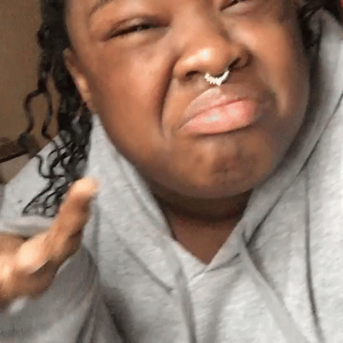 A Woman With A Nose Ring On Her Nose GIF