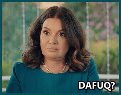 A Woman With A Pearl Necklace Is Making A Funny Face With The Words Dafuq Written Below Her GIF