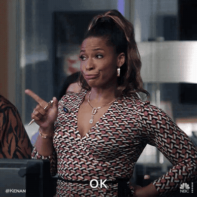 A Woman With A Pen In Her Hand And The Word Ok On The Bottom GIF