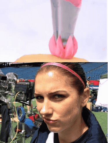 A Woman With A Pink Headband On Has A Pink Object On Her Head GIF