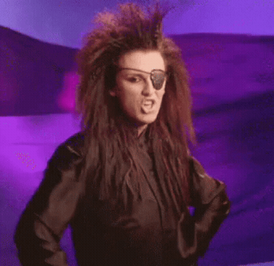 A Woman With A Pirate Eye Patch Is Giving The Middle Finger . GIF
