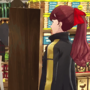 A Woman With A Red Bow In Her Hair Is Standing In Front Of A Shelf That Says Nuts GIF