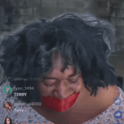 A Woman With A Red Ribbon Around Her Mouth GIF