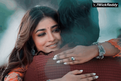 A Woman With A Ring On Her Finger Is Hugging A Man With A 7Wick Reddy Logo In The Corner GIF