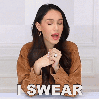 A Woman With A Ring On Her Finger Is Making A Swear Gesture GIF