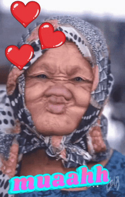 A Woman With A Scarf Around Her Head Is Surrounded By Red Hearts And The Word Muaah GIF