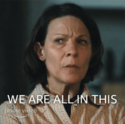 A Woman With A Serious Look On Her Face And The Words We Are All In This Behind Her GIF