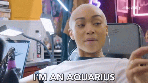 A Woman With A Shaved Head Is Getting A Tattoo And Says " I 'M An Aquarius " GIF