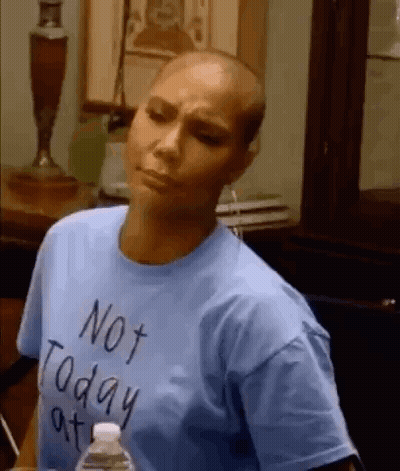 A Woman With A Shaved Head Is Wearing A Blue T-Shirt That Says Not Today At . GIF