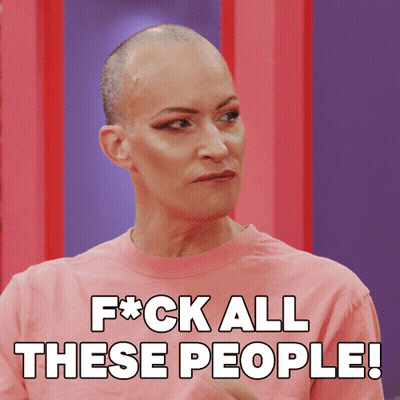 A Woman With A Shaved Head Is Wearing A Pink Shirt That Says F * Ck All These People GIF