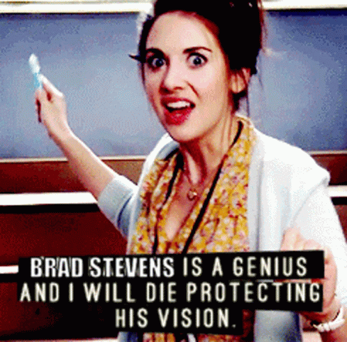 A Woman With A Sign That Says Brad Stevens Is A Genius And I Will Die Protecting His Vision GIF