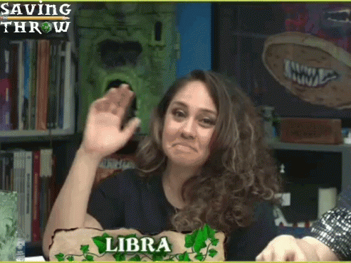 A Woman With A Sign That Says Libra Is Making A Face GIF
