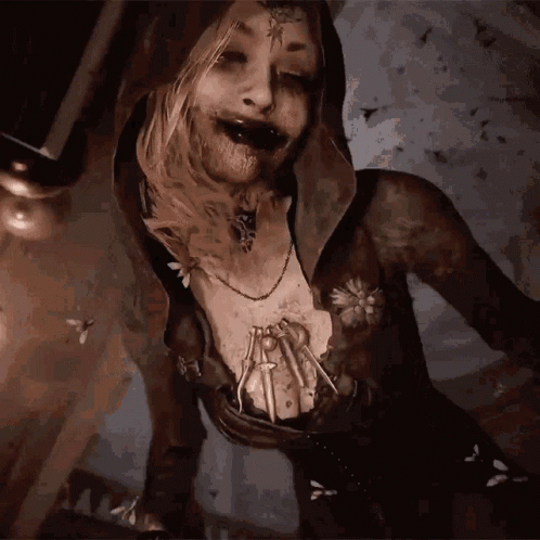 A Woman With A Spider On Her Chest And A Necklace GIF