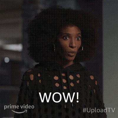 A Woman With A Surprised Look On Her Face And The Word Wow On The Bottom Right GIF