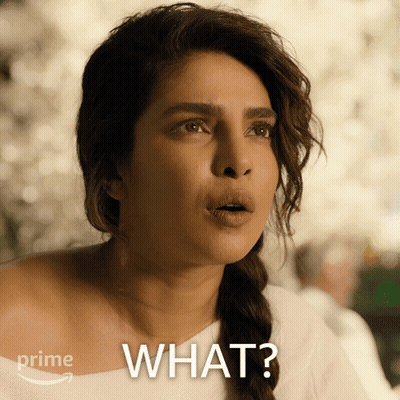 A Woman With A Surprised Look On Her Face And The Words " What " On The Bottom GIF