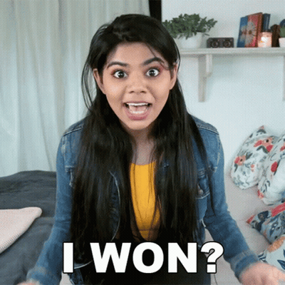A Woman With A Surprised Look On Her Face Is Asking If She Has Won GIF