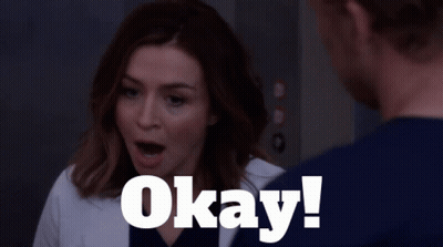 A Woman With A Surprised Look On Her Face Is Next To A Man Who Says Okay GIF