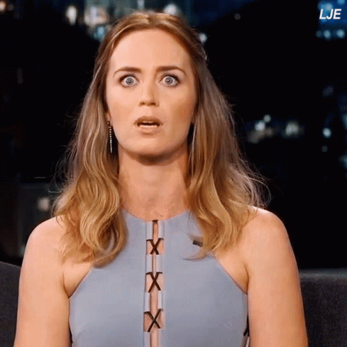 A Woman With A Surprised Look On Her Face Is Sitting In Front Of A Screen That Says Lje On It GIF