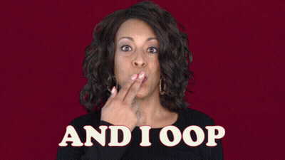 A Woman With A Surprised Look On Her Face Is Standing In Front Of A Sign That Says " And I Oop " GIF