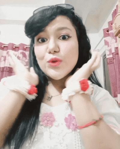 A Woman With A Surprised Look On Her Face Is Wearing Sunglasses GIF