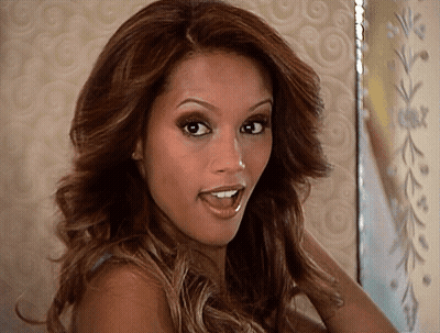 A Woman With A Surprised Look On Her Face Looks At The Camera GIF