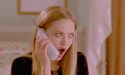 A Woman With A Surprised Look On Her Face Talking On A Cell Phone GIF