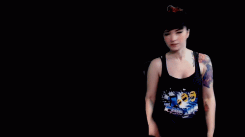 A Woman With A Tattoo On Her Arm And The Words " It 'S Free Real Estate " Behind Her GIF