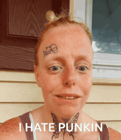 A Woman With A Tattoo On Her Forehead And The Words I Hate Punkin On The Bottom GIF