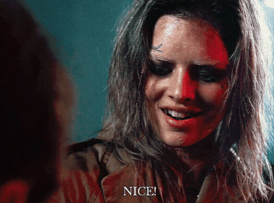 A Woman With A Tattoo On Her Forehead Is Smiling And Says Nice GIF