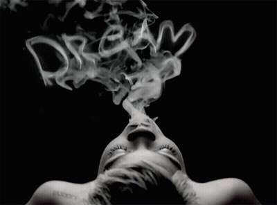 A Woman With A Tattoo On Her Neck Is Smoking GIF