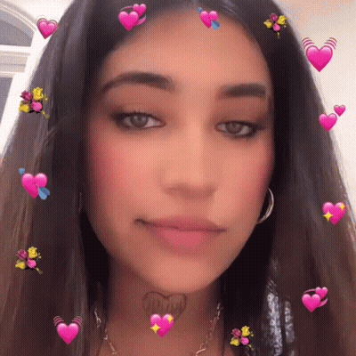 A Woman With A Tattoo On Her Neck That Says " I Love You " GIF