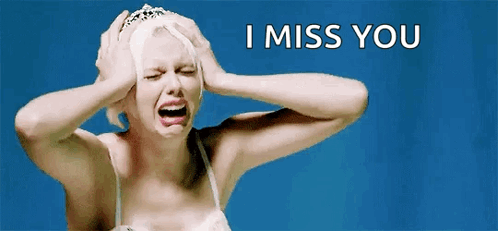 A Woman With A Tiara On Her Head Is Crying And Holding Her Head . GIF