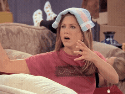 A Woman With A Towel On Her Head Looks Surprised GIF