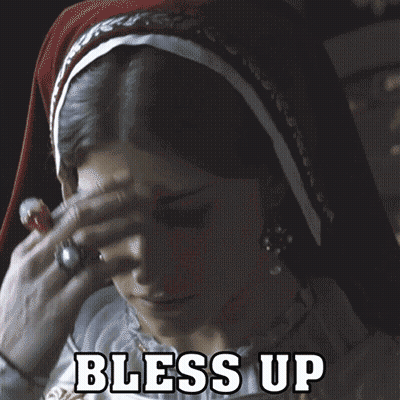 A Woman With A Veil On Her Head And The Words Bless Up Written Above Her GIF