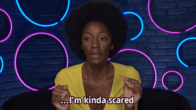 A Woman With An Afro Says I 'M Kinda Scared In Front Of Neon Lights GIF