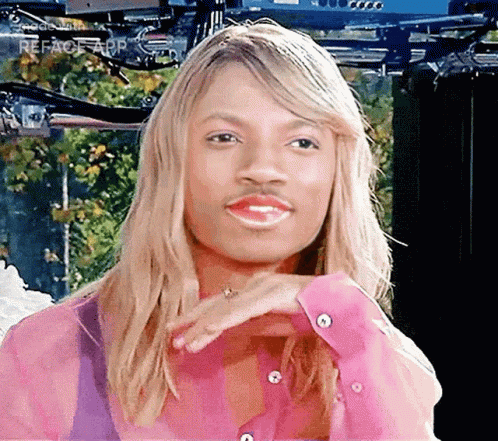 A Woman With Blonde Hair And A Mustache On Her Face GIF