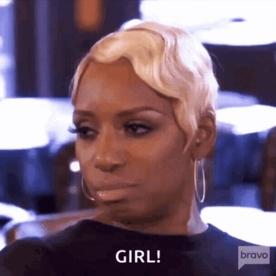 A Woman With Blonde Hair And Hoop Earrings Is Saying Girl GIF