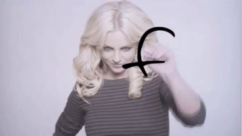 A Woman With Blonde Hair Has The Word Flo Written In Black Marker GIF