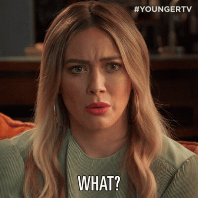 A Woman With Blonde Hair Is Making A Face And Says What GIF