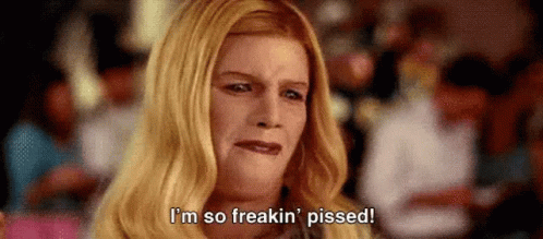 A Woman With Blonde Hair Is Saying `` I 'M So Freakin ' Pissed ! '' GIF